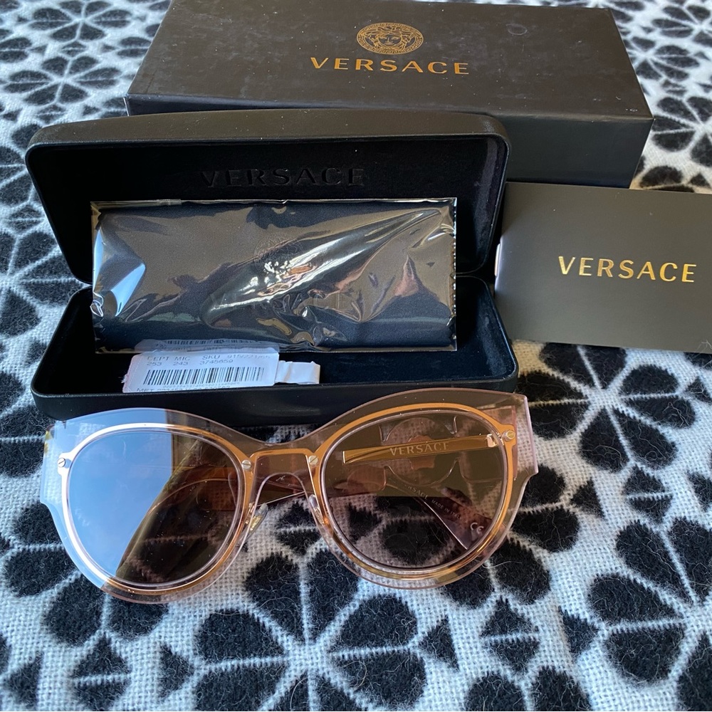New never used Versace sunglasses in original case.